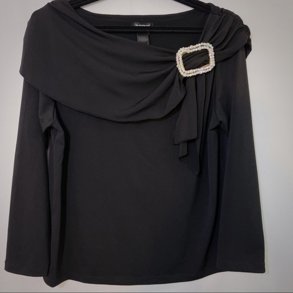 Black top with decorative buckle